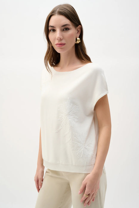 Woman wearing Joseph Ribkoff embroidered floral sweater knit top for office outfit
