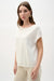 Woman wearing Joseph Ribkoff embroidered floral sweater knit top for office outfit