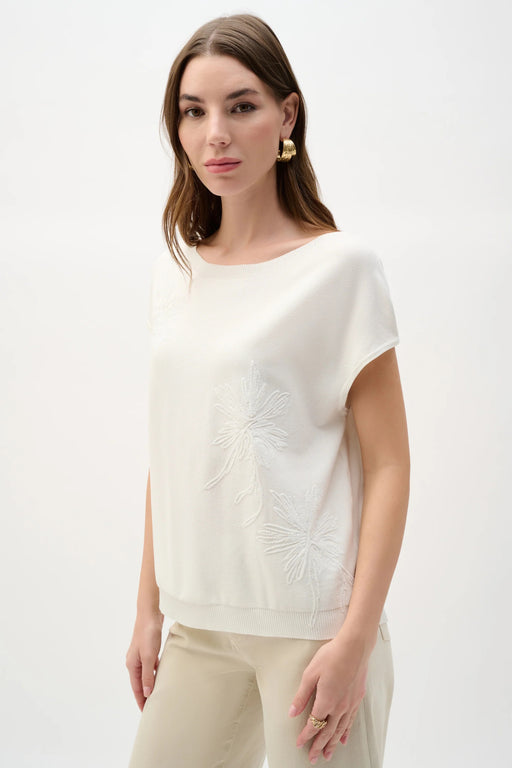 Woman wearing Joseph Ribkoff embroidered floral sweater knit top for office outfit
