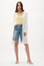 Woman wearing a lightweight gauze open-front cover-up with flare sleeves and side slits, styled for summer layering, travel, resort wear, or casual chic occasions.