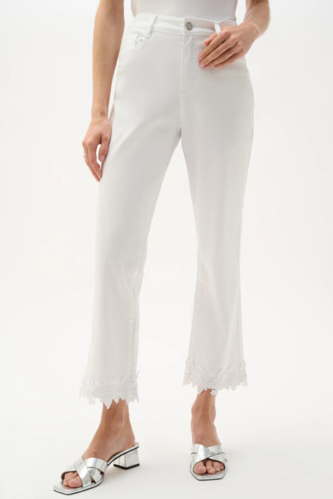 Woman wearing Joseph Ribkoff white denim lace appliqué straight crop jeans styled for brunch, resort vacation, summer outings, and chic casual occasions.