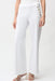 Woman wearing a white pull on sailor jeans with wide leg from Joseph Ribkoff