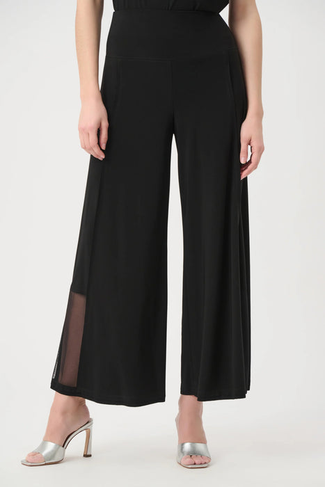 Woman wearing Joseph Ribkoff wide leg pull-on pants with mesh side inserts