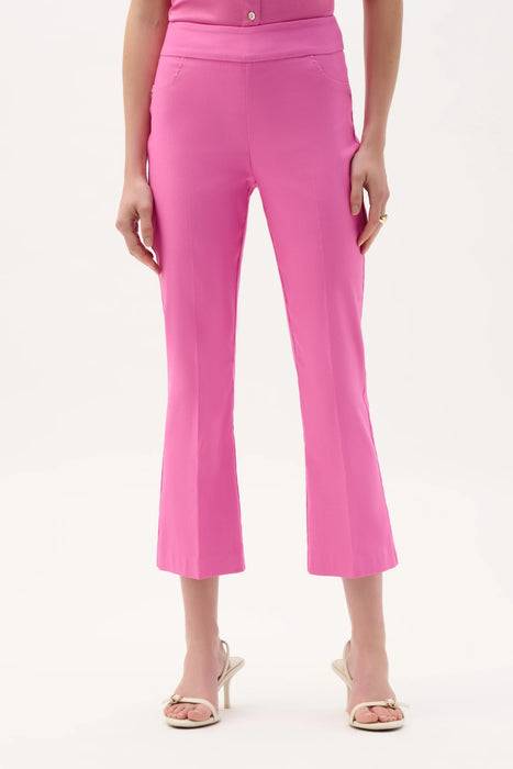 Woman wearing Joseph Ribkoff flare pants with cropped kick leg