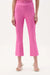 Woman wearing Joseph Ribkoff flare pants with cropped kick leg