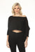 Woman wearing a black high-low cropped sweater top with 3/4 dolman sleeves from Kozan