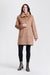 A woman modeling a camel brown mid-length coat with a wide collar, front button closure, and large patch pockets from Nikki Jones