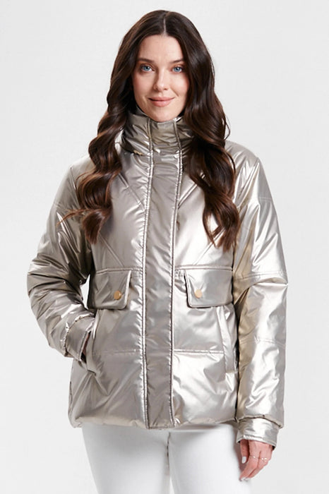 A woman wearing a shiny metallic gold puffer jacket with a high collar and front flap pockets from Nikki Jones