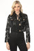 Woman wearing a black patent leather crop jacket with gold buttons with long sleeves and pockets from OO LA LA