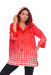 Woman wearing the Oopera red and white polka dot reversible toggle raincoat with an adjustable hood, relaxed fit, and water-repellent fabric.