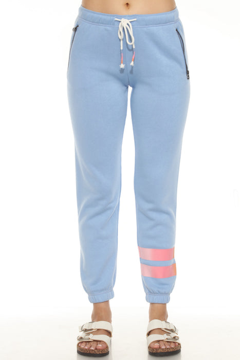 Bright blue sweatpants with pink banded stripe on left leg
