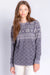 Woman wearing a thermal lounge top with snow flake fair isle pattern and long sleeves