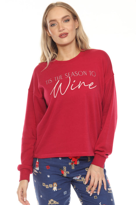 Woman wearing a red fleece pullover with 'Tis the Season to Wine' embroidery at the front and long sleeves