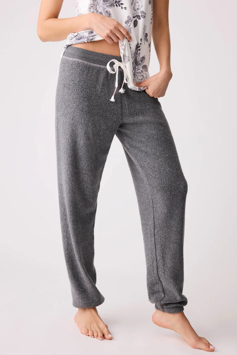 Person wearing gray fleece jogger lounge pant with drawstring waistband