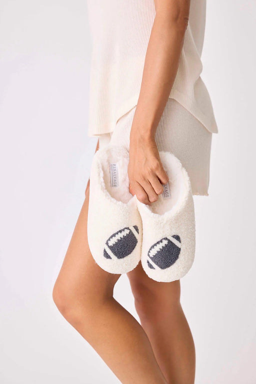 White faux shearling white slippers with football pattern at the top