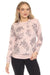 Woman wearing a pink pullover lounge top with rose print all over and raglan sleeves