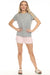 Woman wearing pajama set including a gray top and a pink short with "love" text graphic all over
