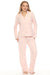 Woman wearing a pink cable knit pajama set from PJ Salvage
