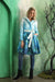 Women wearing Samuel Dong Aqua Seaweed print bubble coat dress with statement collar, self-tie belt, and bubble hem
