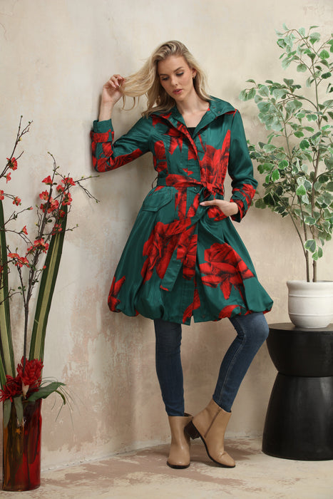 Woman wearing Samuel Dong Emerald Rose print bubble coat dress with statement collar, self-tie belt, and bubble hem