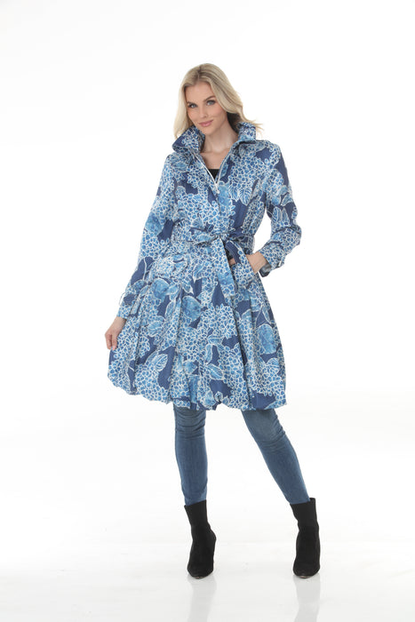 Woman wearing Samuel Dong indigo floral print bubble coat dress with statement collar and belt
